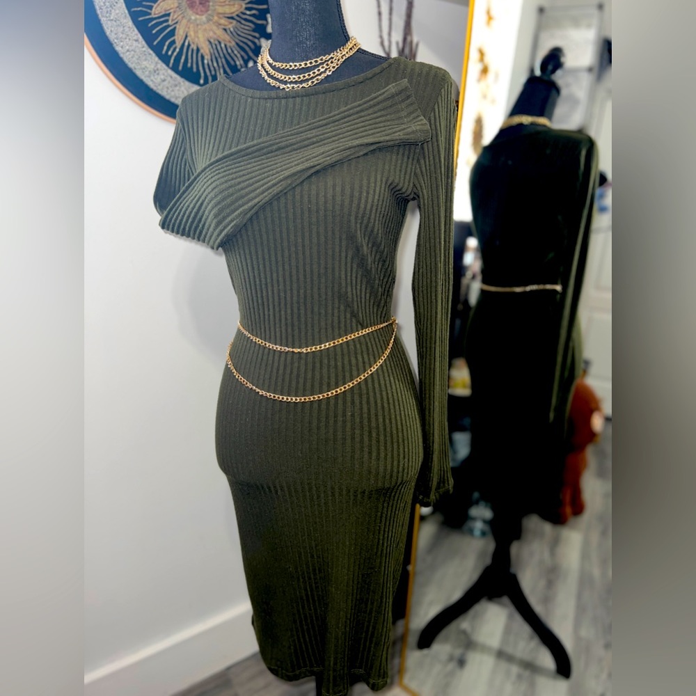 Mid knee length forest green long sleeve dress.